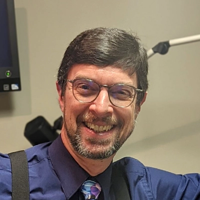Eye Doctor David Littlejohn Smiling In Dress Shirt And Tie